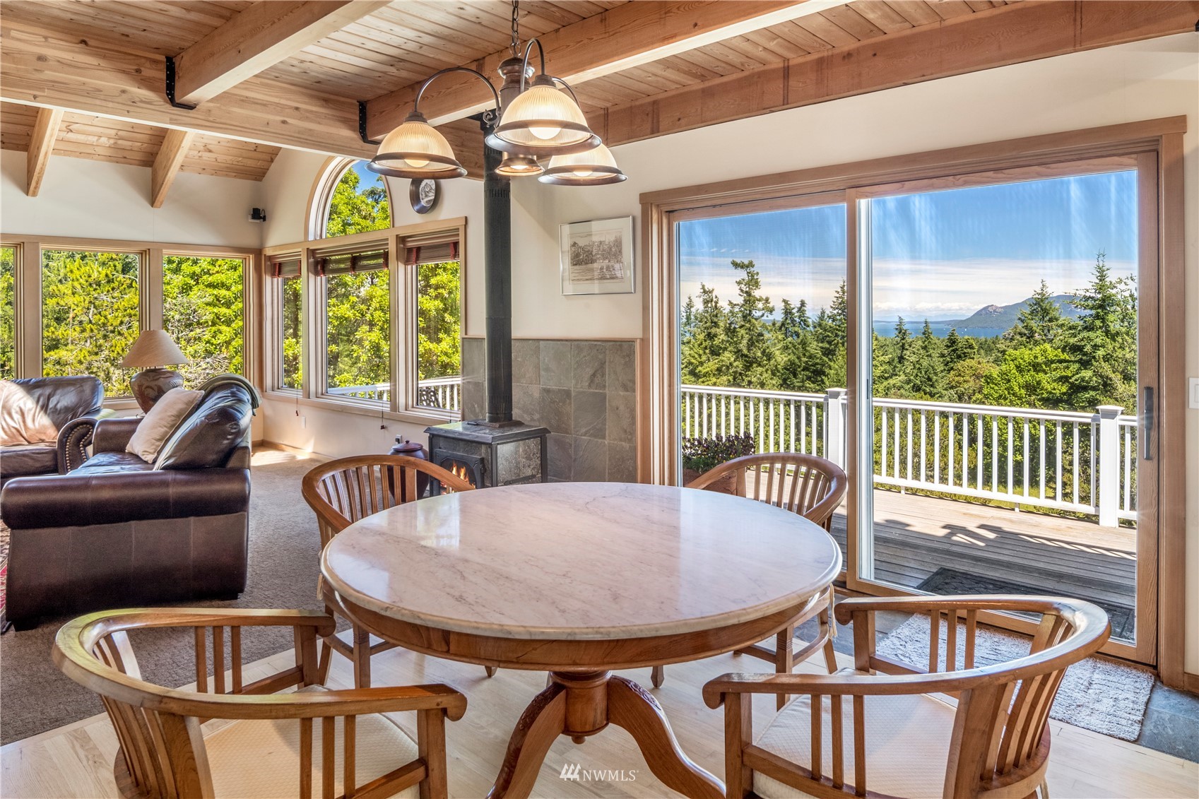 338 Sunrise Ridge Road San Juan Island, WA 98250 - Photo 10 of 39 a view of a dining room with furniture window and outside view