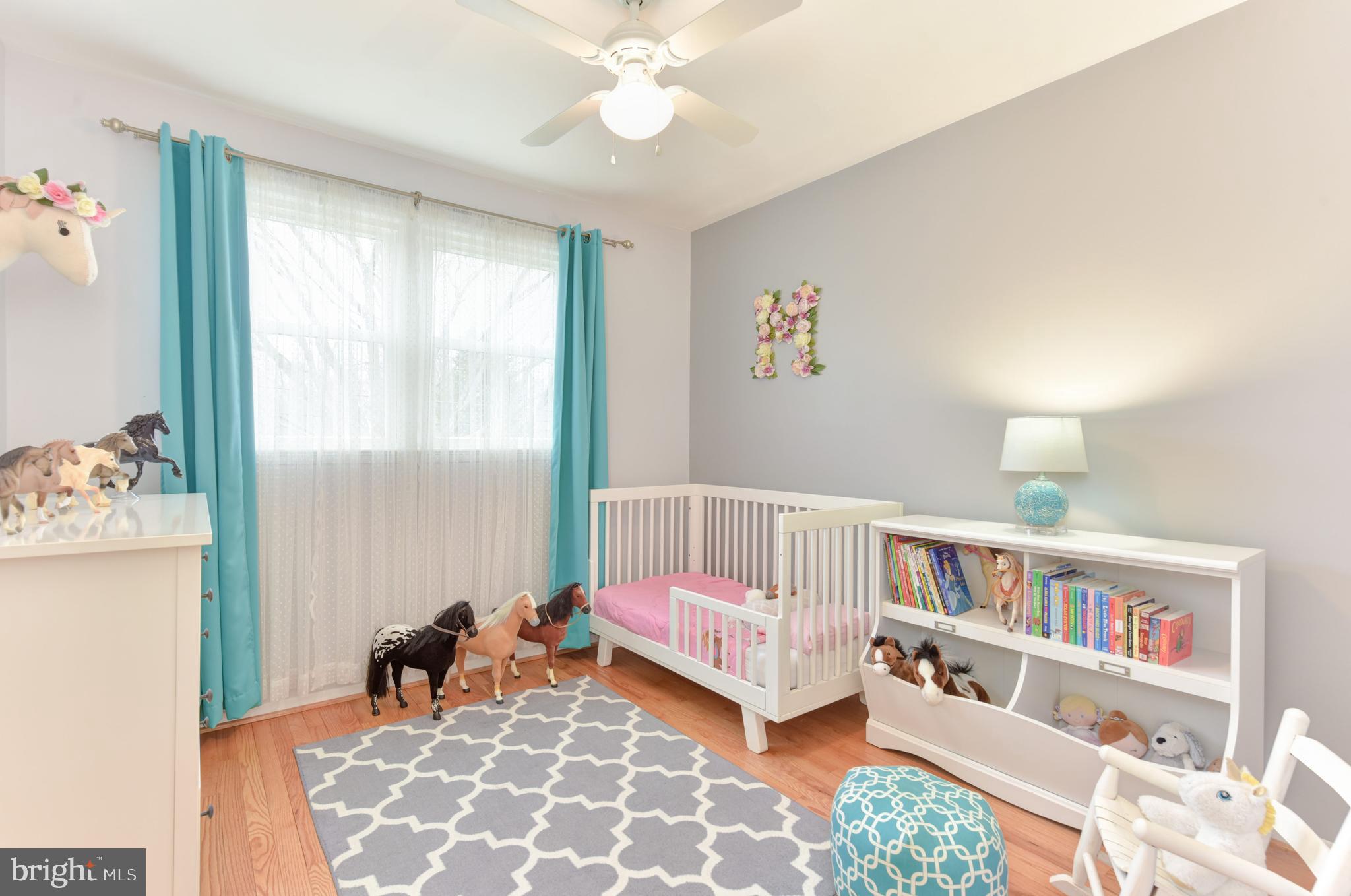 7309 Dunston Street Springfield, VA 22151 - Photo 18 of 37 Secondary bedroom with wood floors & fan