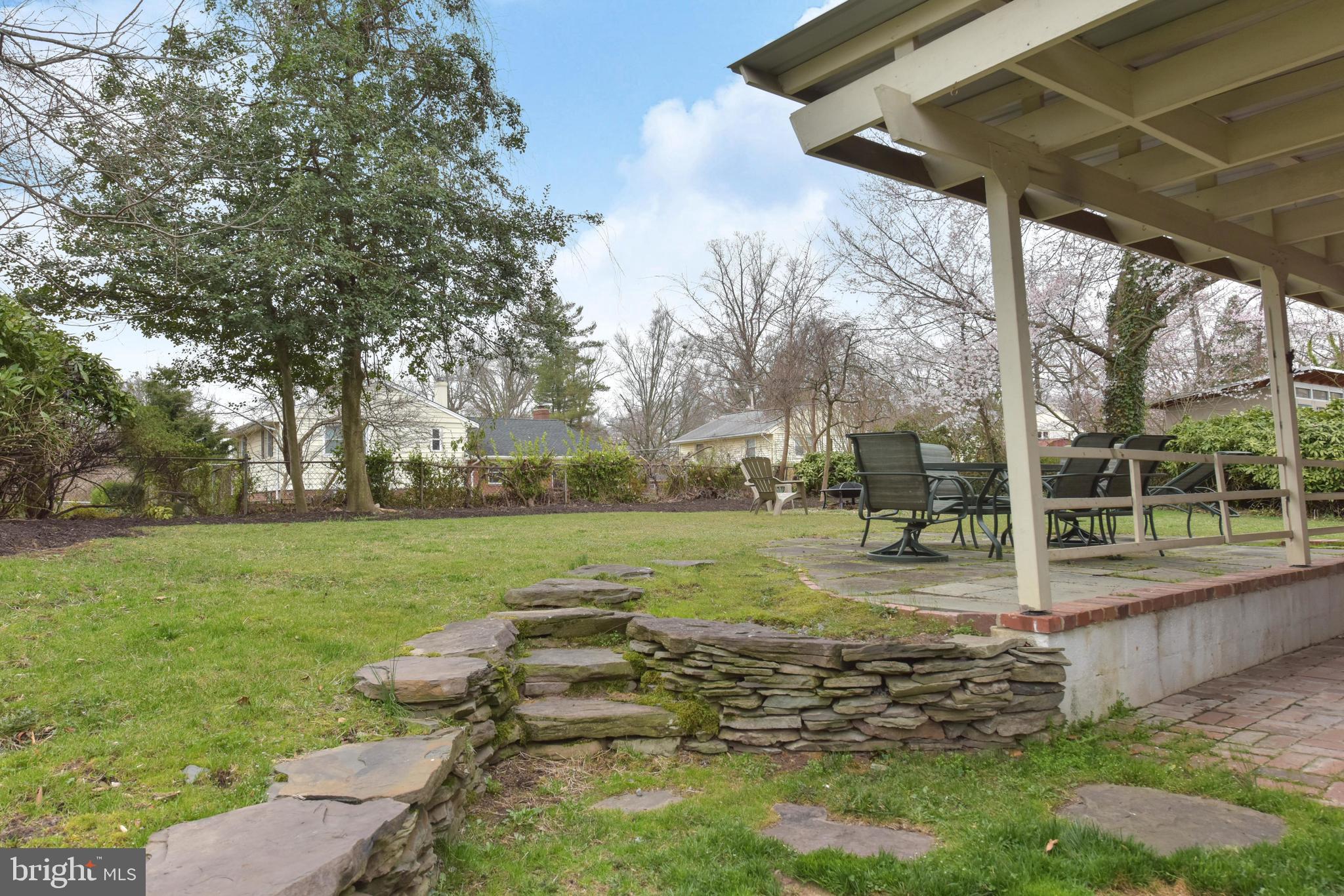 7309 Dunston Street Springfield, VA 22151 - Photo 28 of 37 Amazing back yard. Stone wall, flat play area