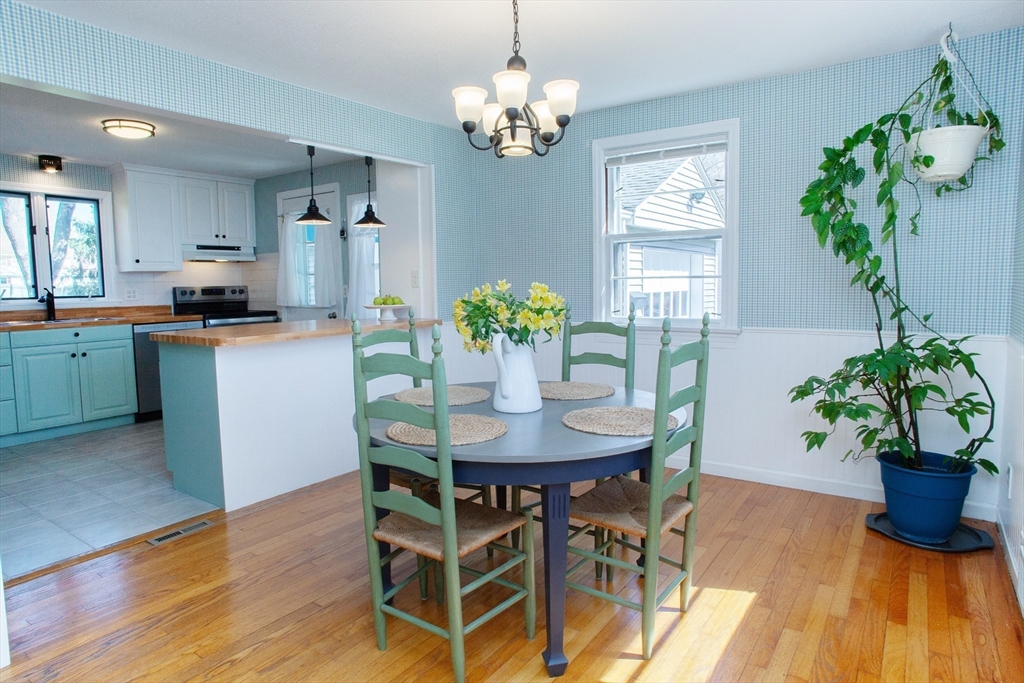 31 East Allen Ridge Road Springfield, MA 01118 - Photo 11 of 34 a dining room filled chandelier and wooden floor