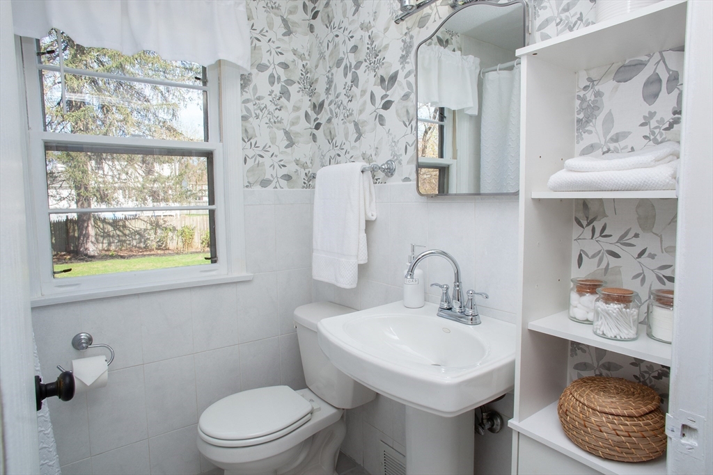 31 East Allen Ridge Road Springfield, MA 01118 - Photo 17 of 34 a bathroom with a sink a toilet and a mirror