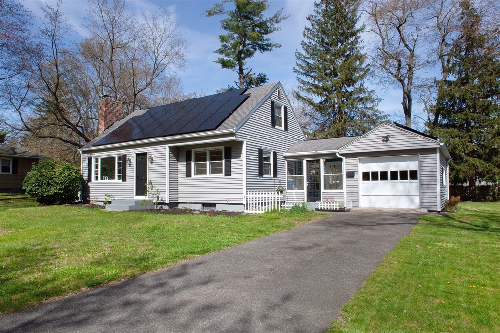 31 East Allen Ridge Road Springfield, MA 01118 - Photo 2 of 34 a front view of a house with a garden and yard