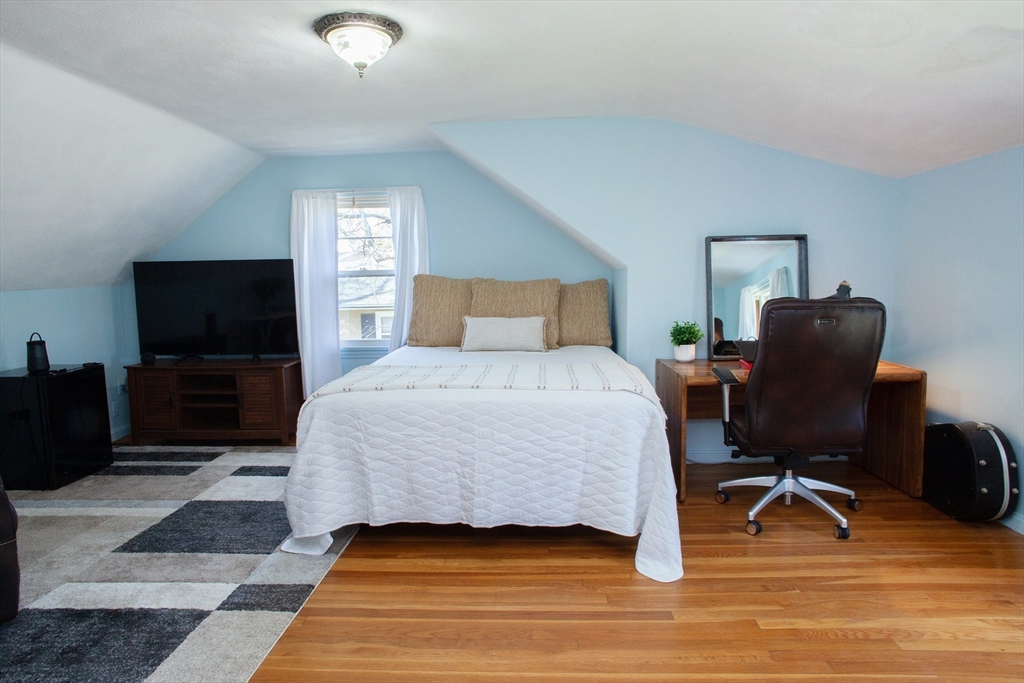 31 East Allen Ridge Road Springfield, MA 01118 - Photo 21 of 34 a bedroom with a bed and a television
