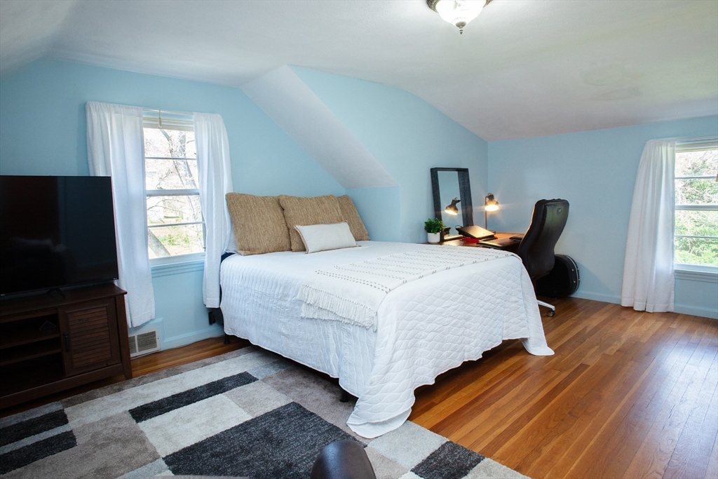 31 East Allen Ridge Road Springfield, MA 01118 - Photo 22 of 34 a bedroom with bed tv and window