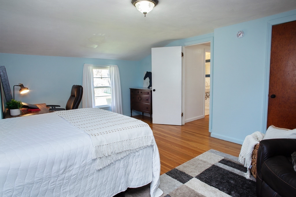 31 East Allen Ridge Road Springfield, MA 01118 - Photo 23 of 34 a bed room with a bed and a chair