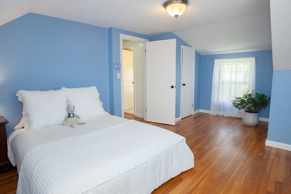 31 East Allen Ridge Road Springfield, MA 01118 - Photo 24 of 34 a bedroom with a bed and a potted plant