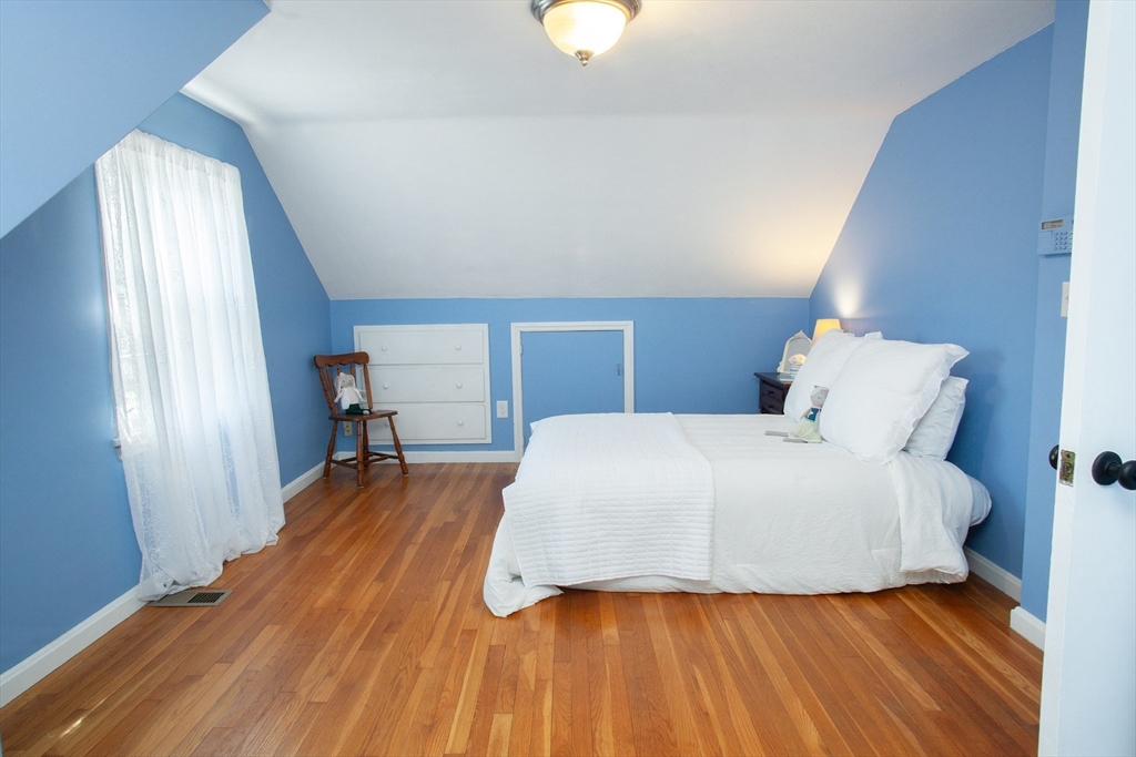31 East Allen Ridge Road Springfield, MA 01118 - Photo 25 of 34 a bedroom with a bed lamp and a large window