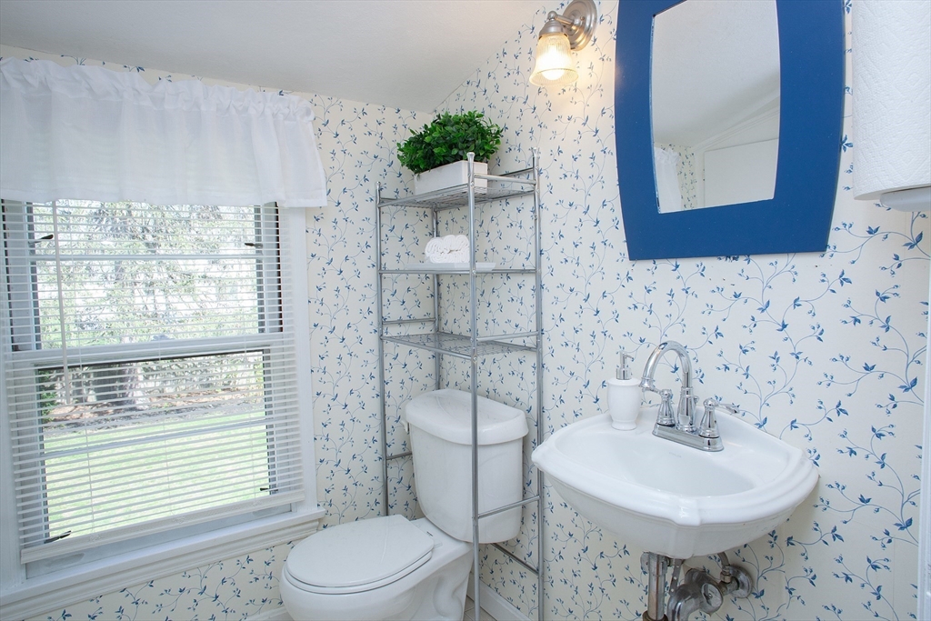 31 East Allen Ridge Road Springfield, MA 01118 - Photo 29 of 34 a bathroom with a sink toilet and mirror