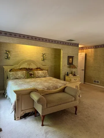 a bedroom with a bed and a table