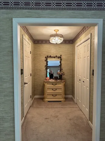 a view of a hallway with washer and dryer