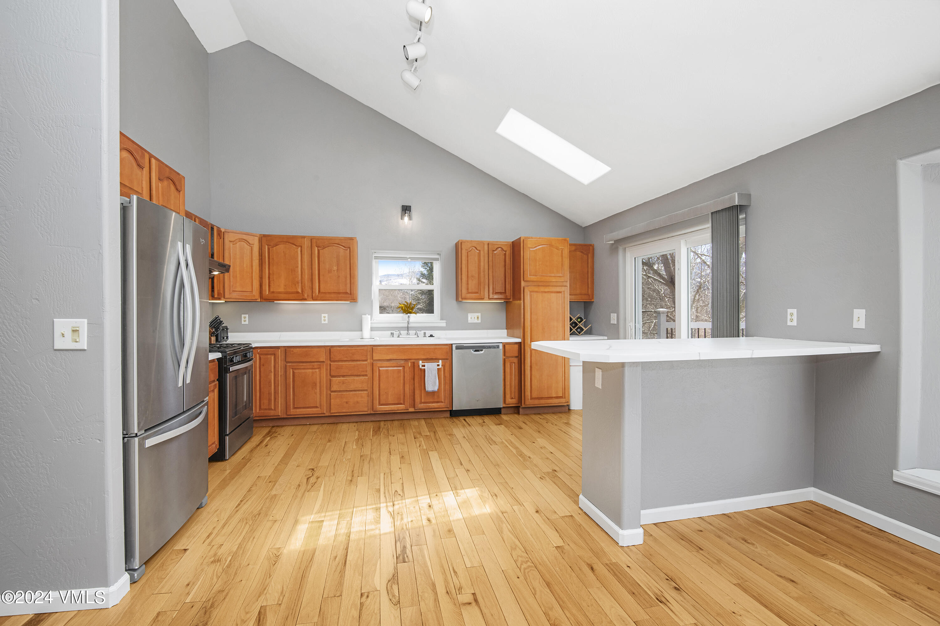 6 Ringneck Eagle, CO 81631 - Photo 13 of 59 a large kitchen with a lot of counter space and wooden floor