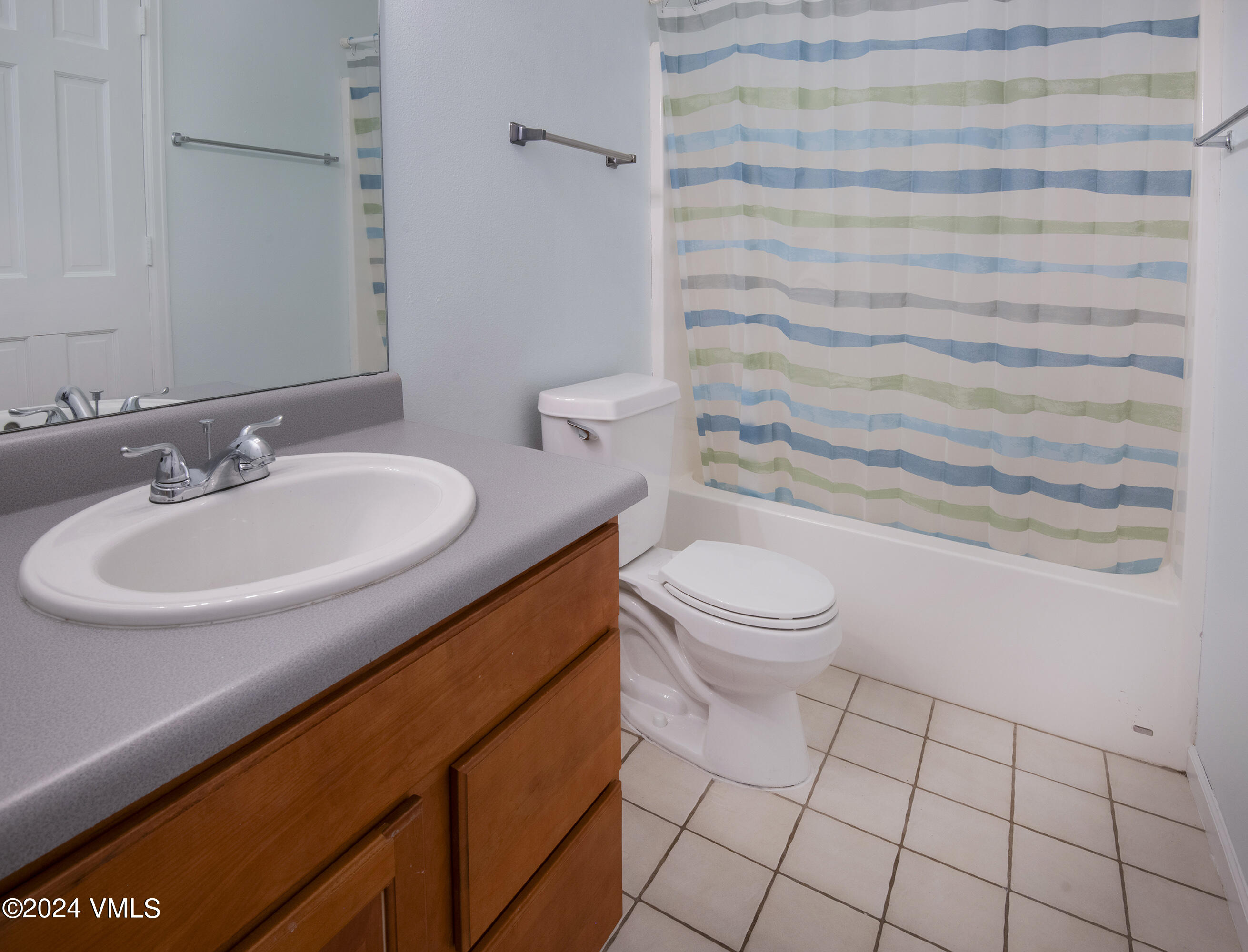 6 Ringneck Eagle, CO 81631 - Photo 38 of 59 a bathroom with a sink a toilet and shower curtain