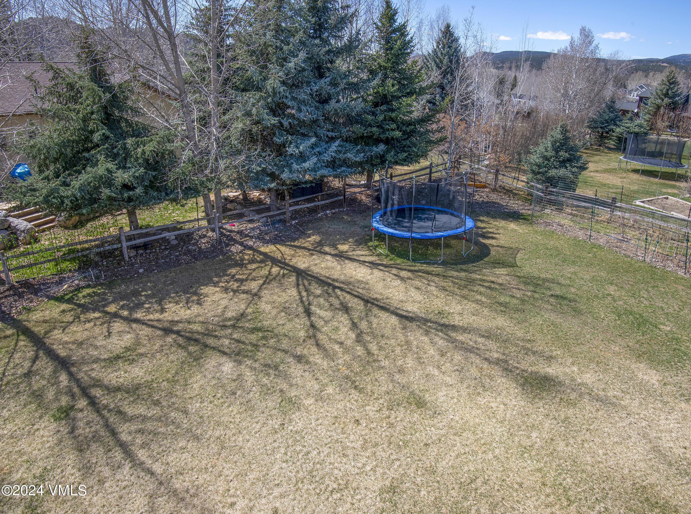 6 Ringneck Eagle, CO 81631 - Photo 47 of 59 a view of a backyard with plants and a water fountain