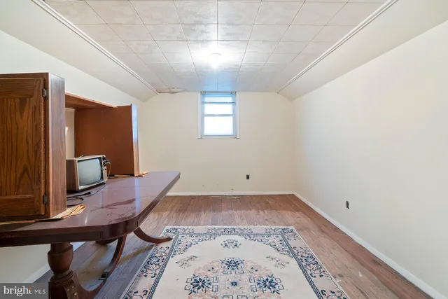 a room with furniture and a wooden floor