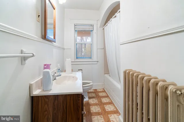 a bathroom with a sink and mirror