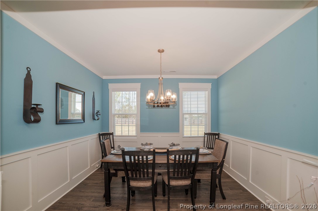 1537 Creekwood Road Hope Mills, NC 28348 - Photo 11 of 41 a view of a dining room with furniture and window