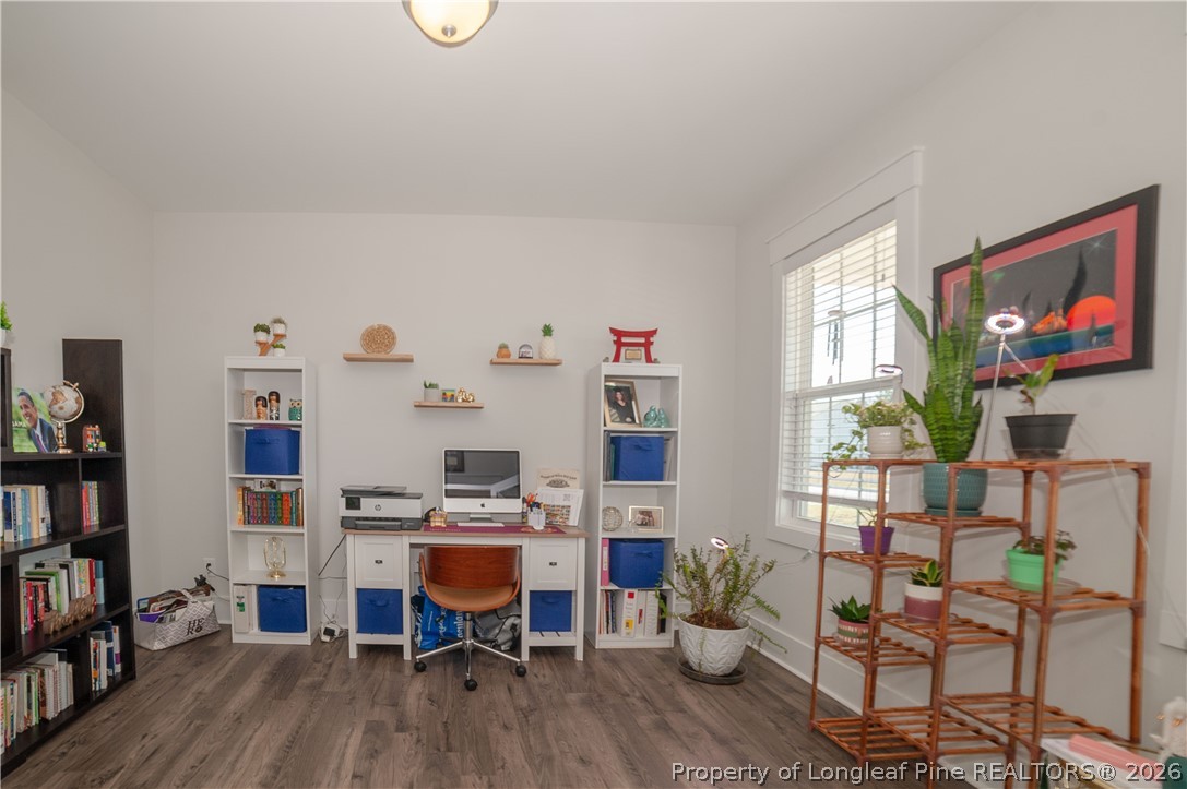 1537 Creekwood Road Hope Mills, NC 28348 - Photo 18 of 41 a room with furniture and a book shelf