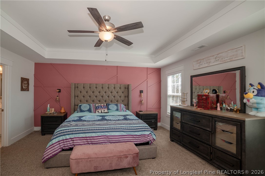 1537 Creekwood Road Hope Mills, NC 28348 - Photo 21 of 41 a bedroom with a bed and a dresser in it
