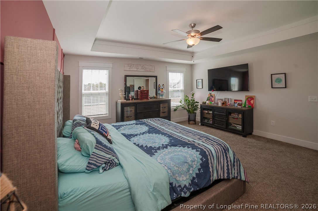 1537 Creekwood Road Hope Mills, NC 28348 - Photo 23 of 41 a bedroom with a bed and a flat screen tv