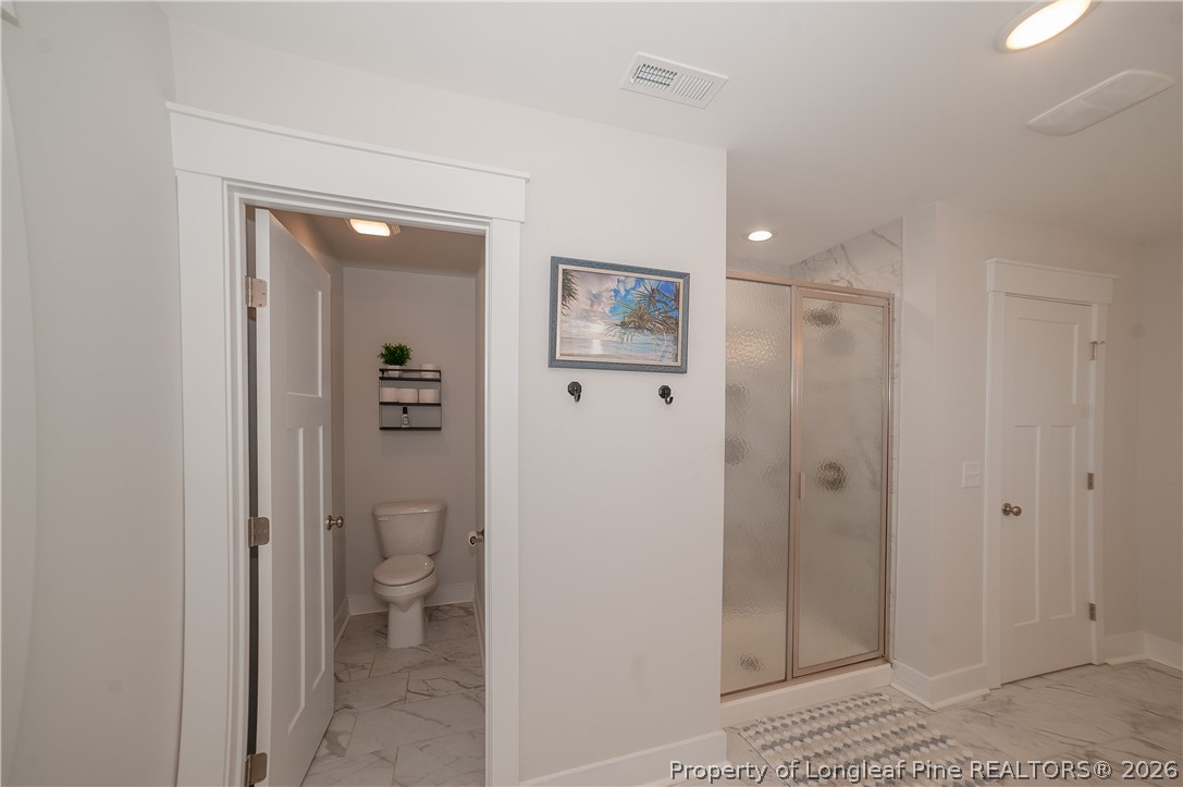 1537 Creekwood Road Hope Mills, NC 28348 - Photo 26 of 41 a bathroom with a toilet and a shower