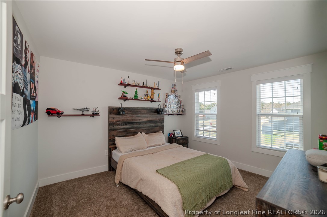 1537 Creekwood Road Hope Mills, NC 28348 - Photo 28 of 41 a bedroom with a bed and a window