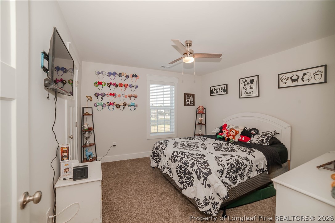 1537 Creekwood Road Hope Mills, NC 28348 - Photo 29 of 41 a bedroom with a bed and a walk in closet