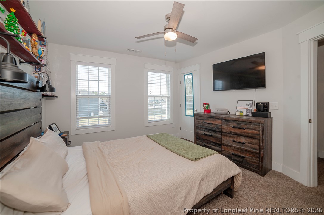 1537 Creekwood Road Hope Mills, NC 28348 - Photo 31 of 41 a bedroom with a bed and a flat screen tv