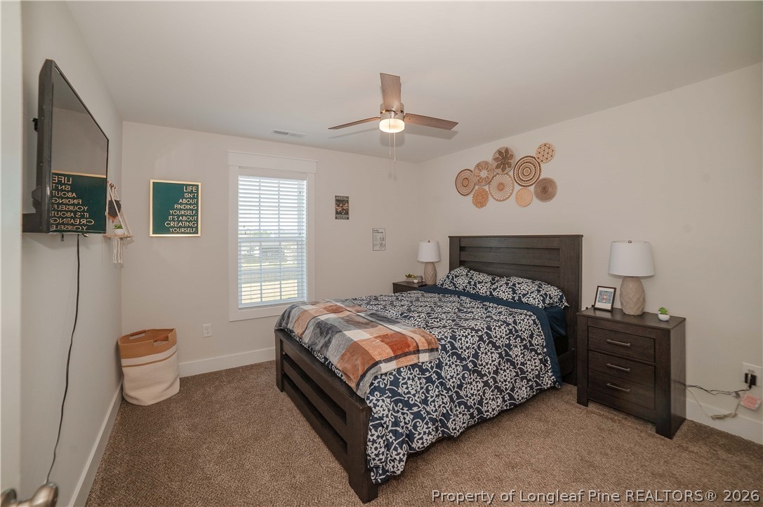 1537 Creekwood Road Hope Mills, NC 28348 - Photo 33 of 41 a bedroom with a bed and a window