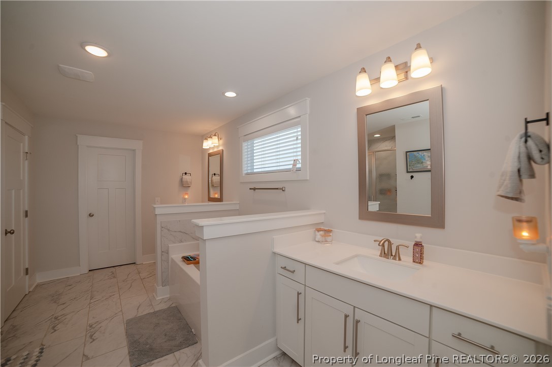 1537 Creekwood Road Hope Mills, NC 28348 - Photo 35 of 41 a bathroom with a sink vanity and mirror