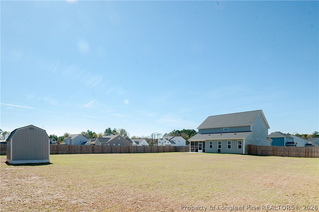 1537 Creekwood Road Hope Mills, NC 28348 - Photo 39 of 41 a view of a field with an ocean in the background