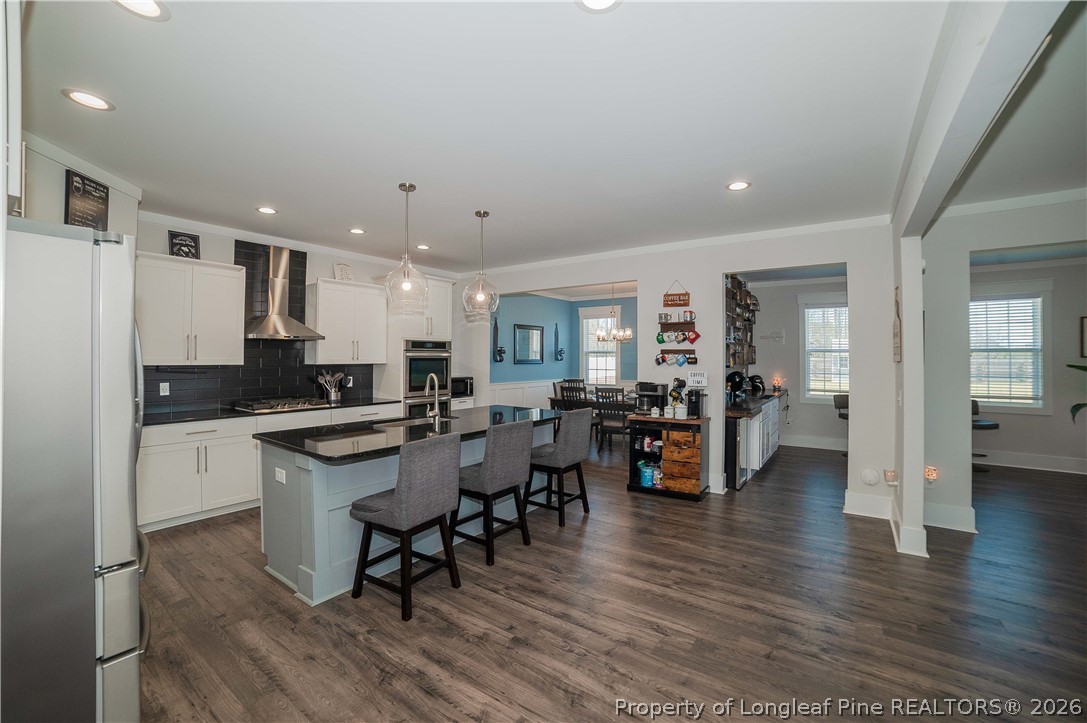 1537 Creekwood Road Hope Mills, NC 28348 - Photo 6 of 41 a large kitchen with lots of counter space and stainless steel appliances