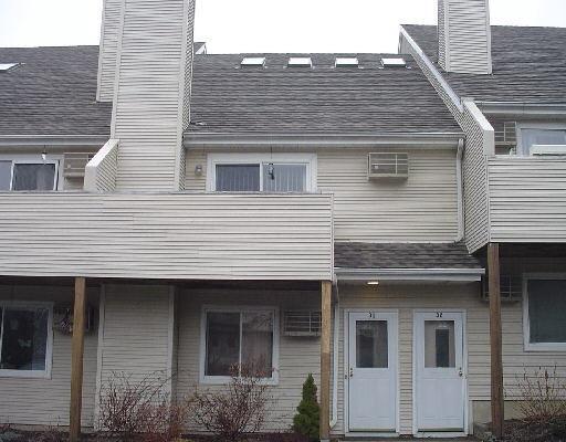 136 Pembroke Road, Unit 31 Danbury, CT 06811 - Photo 1 of 1 a front view of a house