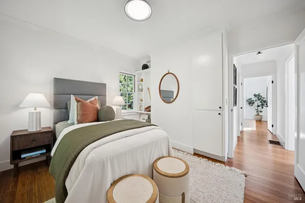 a bed room with a bed mirror and a bathroom