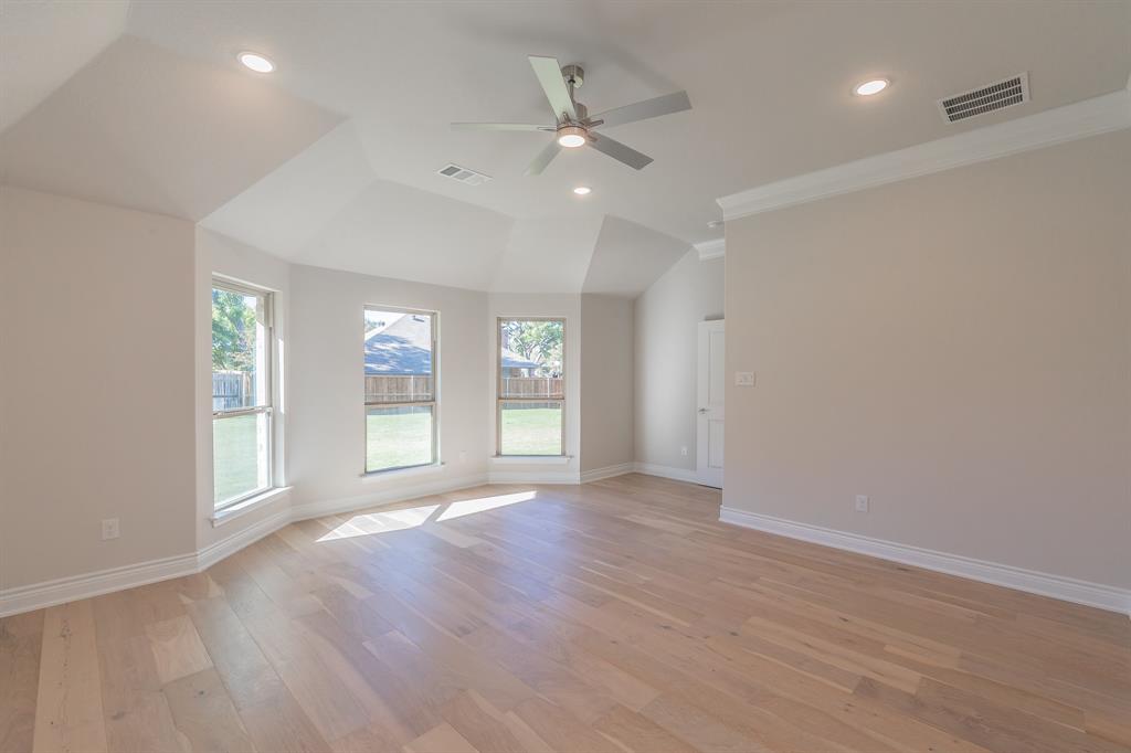 609 Keel Way Azle, TX 76020 - Photo 24 of 32 a view of an empty room with a window and wooden floor