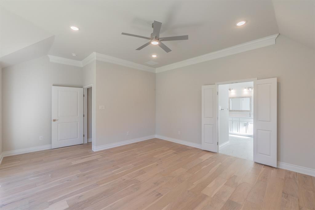 609 Keel Way Azle, TX 76020 - Photo 25 of 32 an empty room with wooden floor and windows