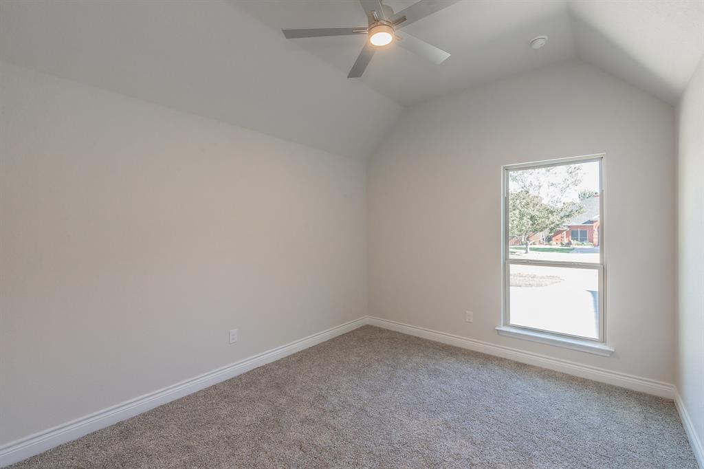 609 Keel Way Azle, TX 76020 - Photo 5 of 32 an empty room with a window