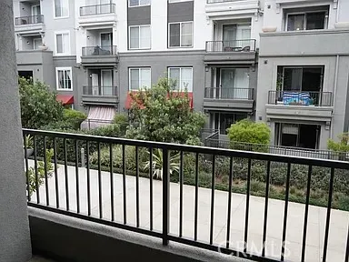 a view of a brick building next to a yard