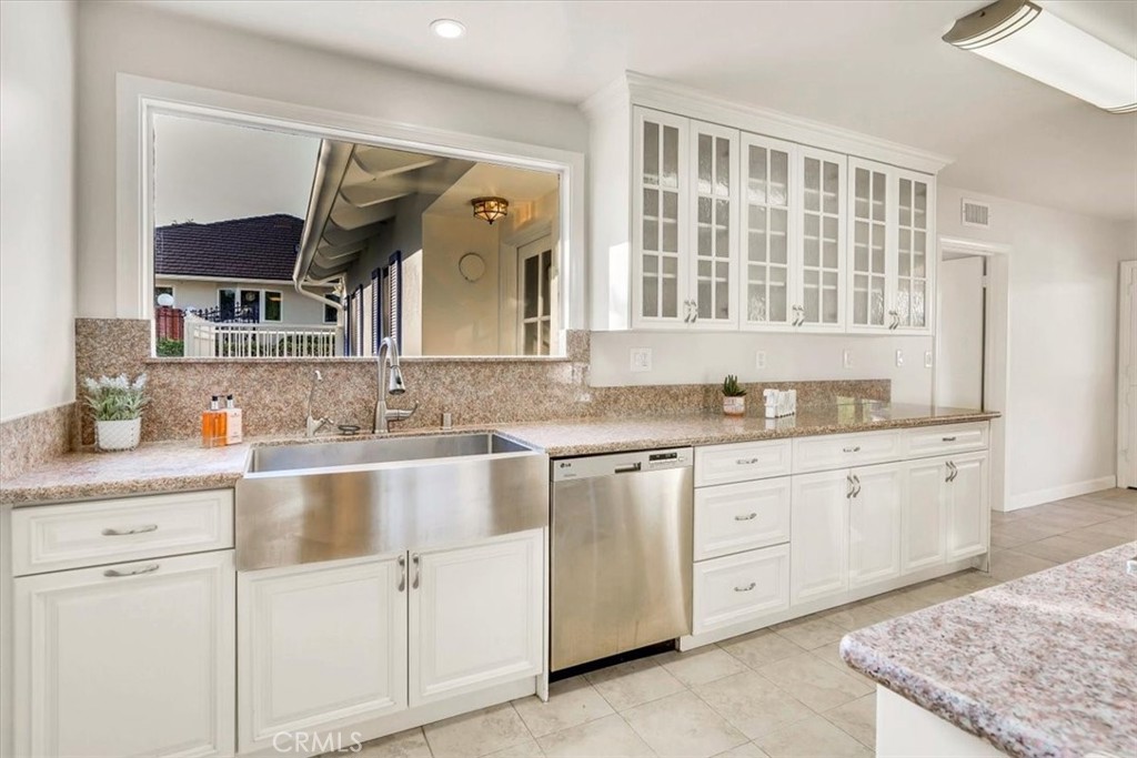 2355 Montecito Drive San Marino, CA 91108 - Photo 12 of 47 a bathroom with granite countertop a sink and a mirror