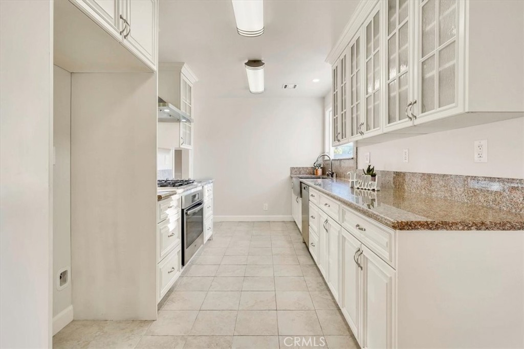 2355 Montecito Drive San Marino, CA 91108 - Photo 16 of 47 a large kitchen with granite countertop a sink and dishwasher a stove with wooden floor