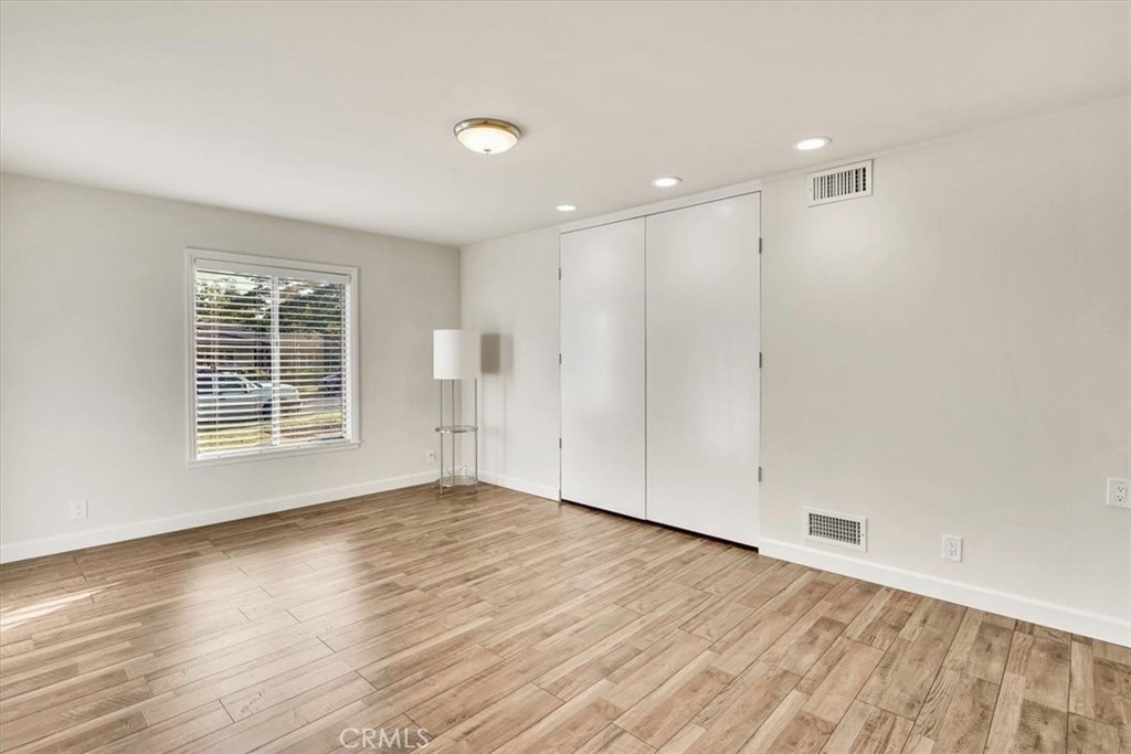 2355 Montecito Drive San Marino, CA 91108 - Photo 20 of 47 a view of an empty room with wooden floor and a window