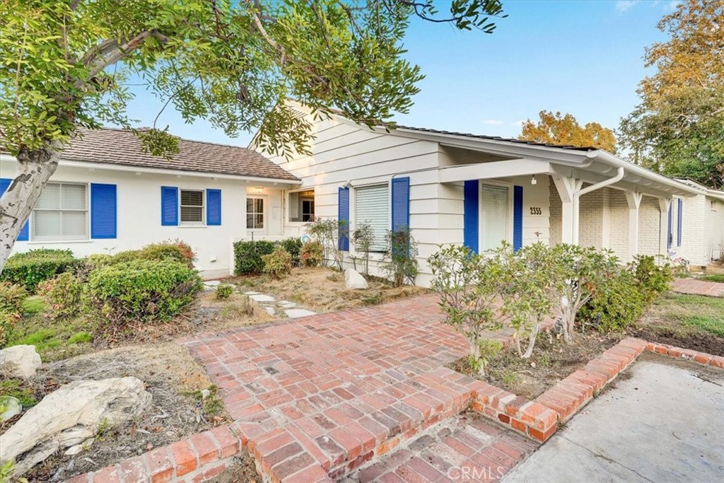 2355 Montecito Drive San Marino, CA 91108 - Photo 2 of 47 a front view of a house with a yard