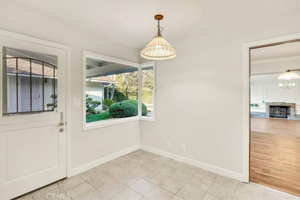 2355 Montecito Drive San Marino, CA 91108 - Photo 21 of 47 a view of a room with wooden floor chandeliers and kitchen view