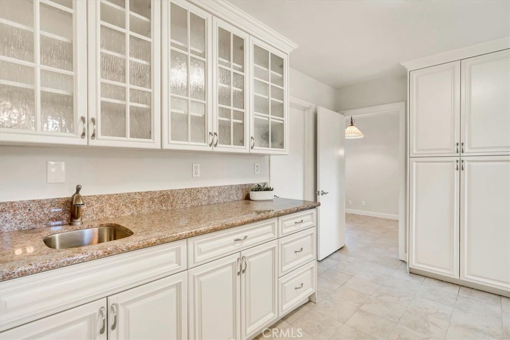 2355 Montecito Drive San Marino, CA 91108 - Photo 25 of 47 a kitchen with a sink and cabinets