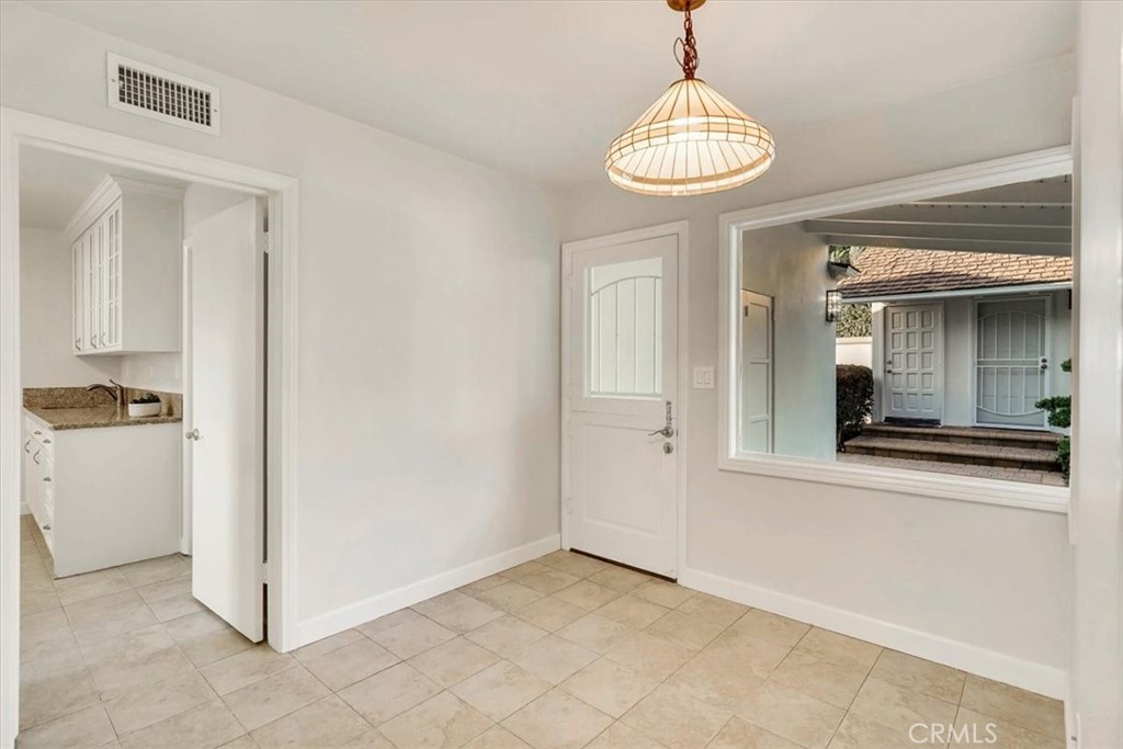 2355 Montecito Drive San Marino, CA 91108 - Photo 27 of 47 a view of a hallway with chandelier and a chandelier