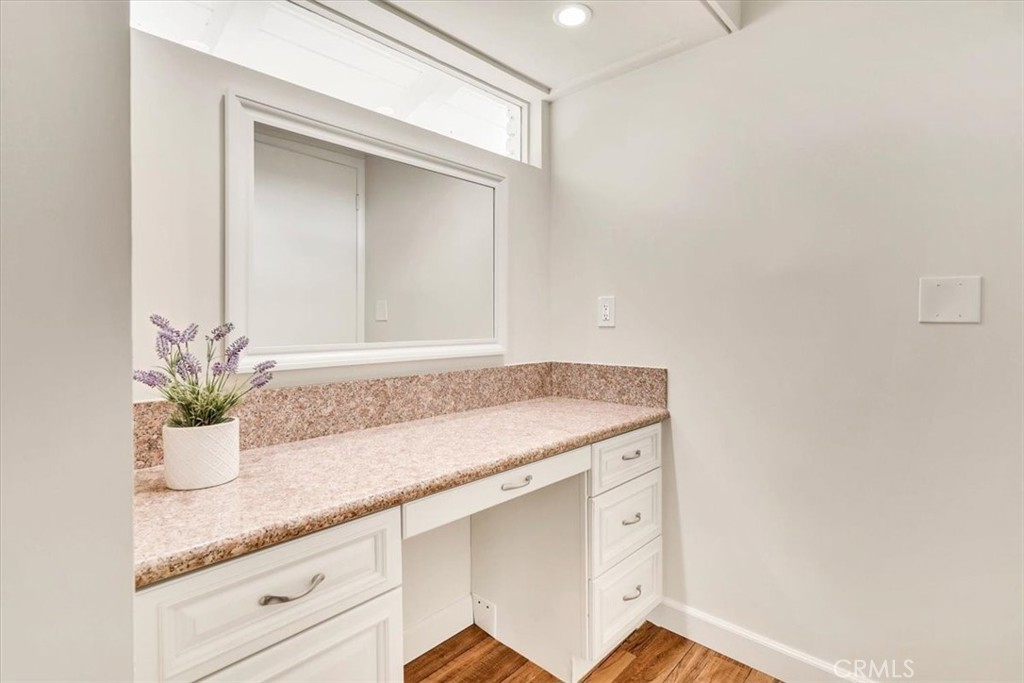 2355 Montecito Drive San Marino, CA 91108 - Photo 35 of 47 a bathroom with a granite countertop sink and a mirror