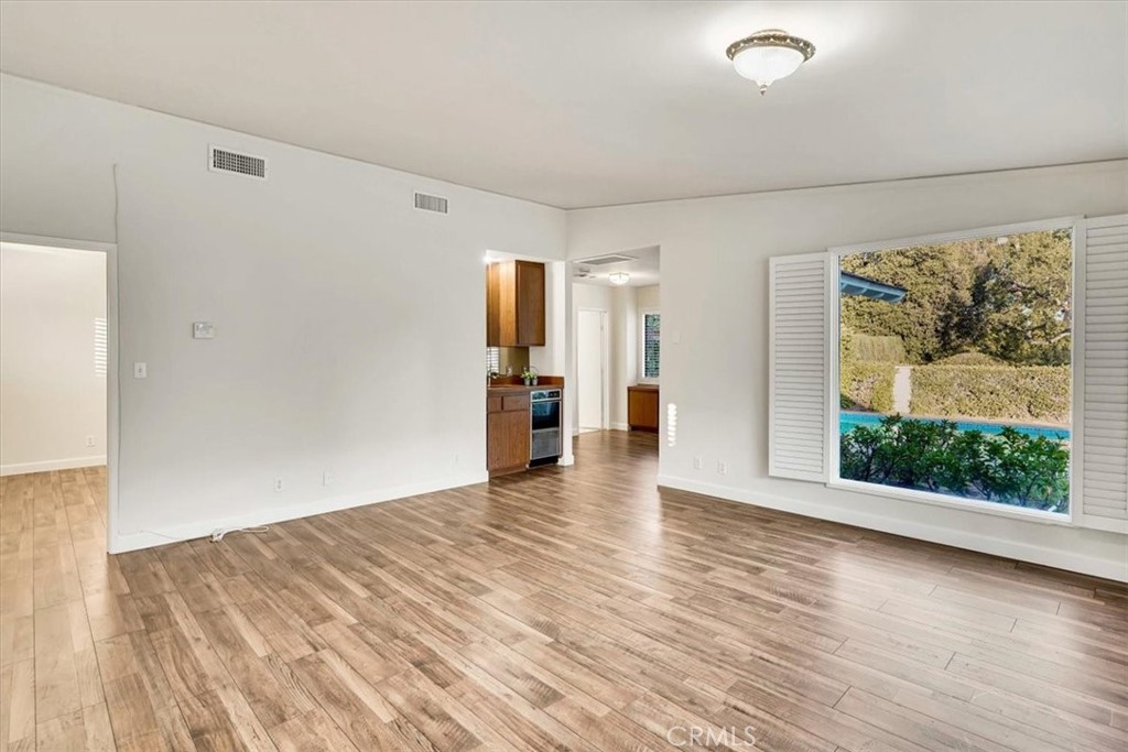 2355 Montecito Drive San Marino, CA 91108 - Photo 40 of 47 a view of an empty room with wooden floor and a window