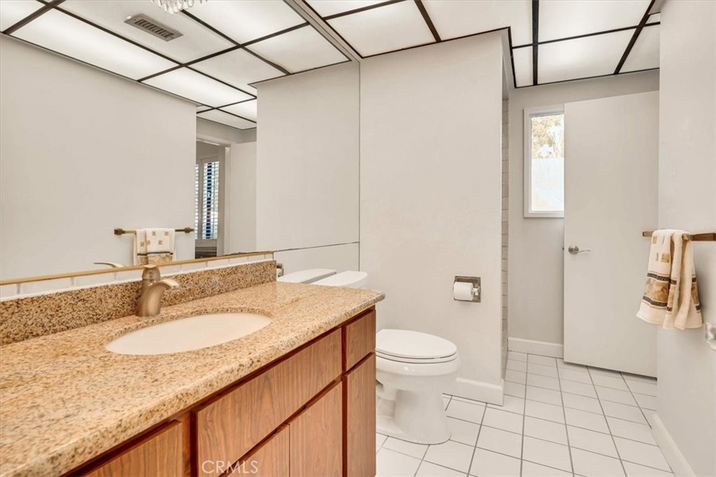 2355 Montecito Drive San Marino, CA 91108 - Photo 44 of 47 a bathroom with a granite countertop sink toilet and shower