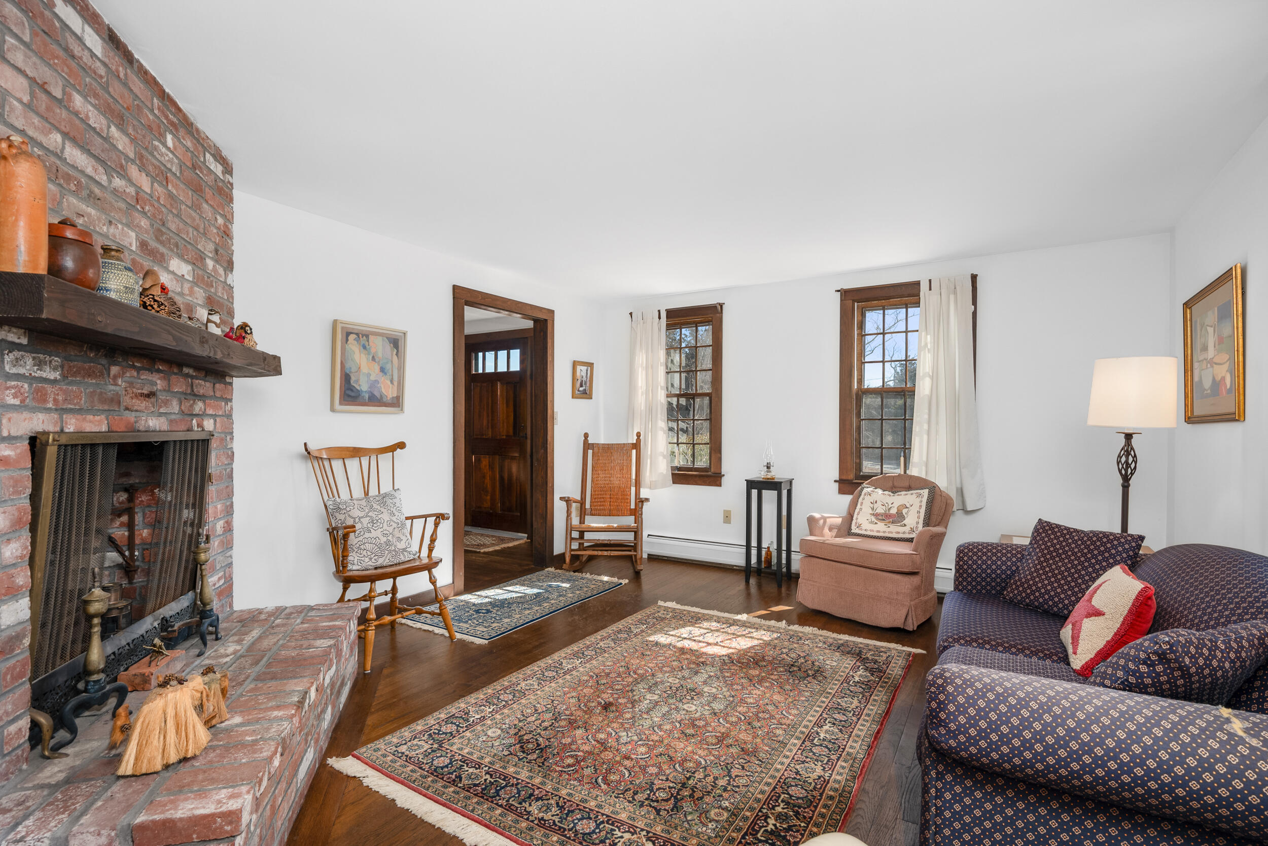 80 Dyer Prince Road Eastham, MA 02642 - Photo 14 of 39 a living room with furniture and a fireplace