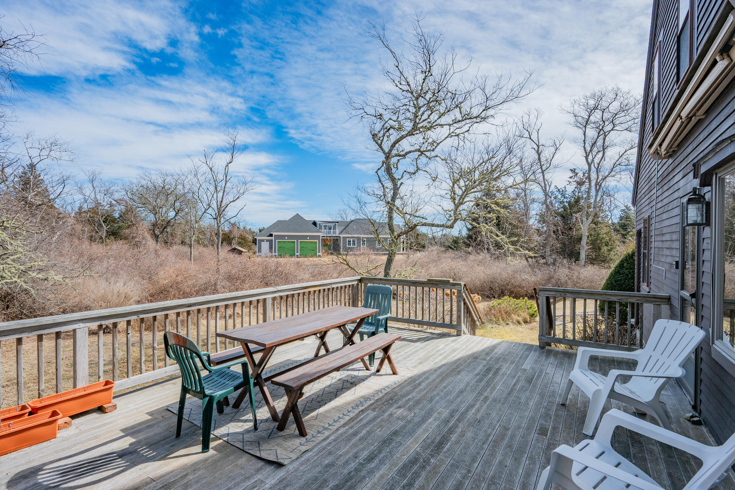 80 Dyer Prince Road Eastham, MA 02642 - Photo 31 of 39 a view of a balcony with wooden floor and seating space