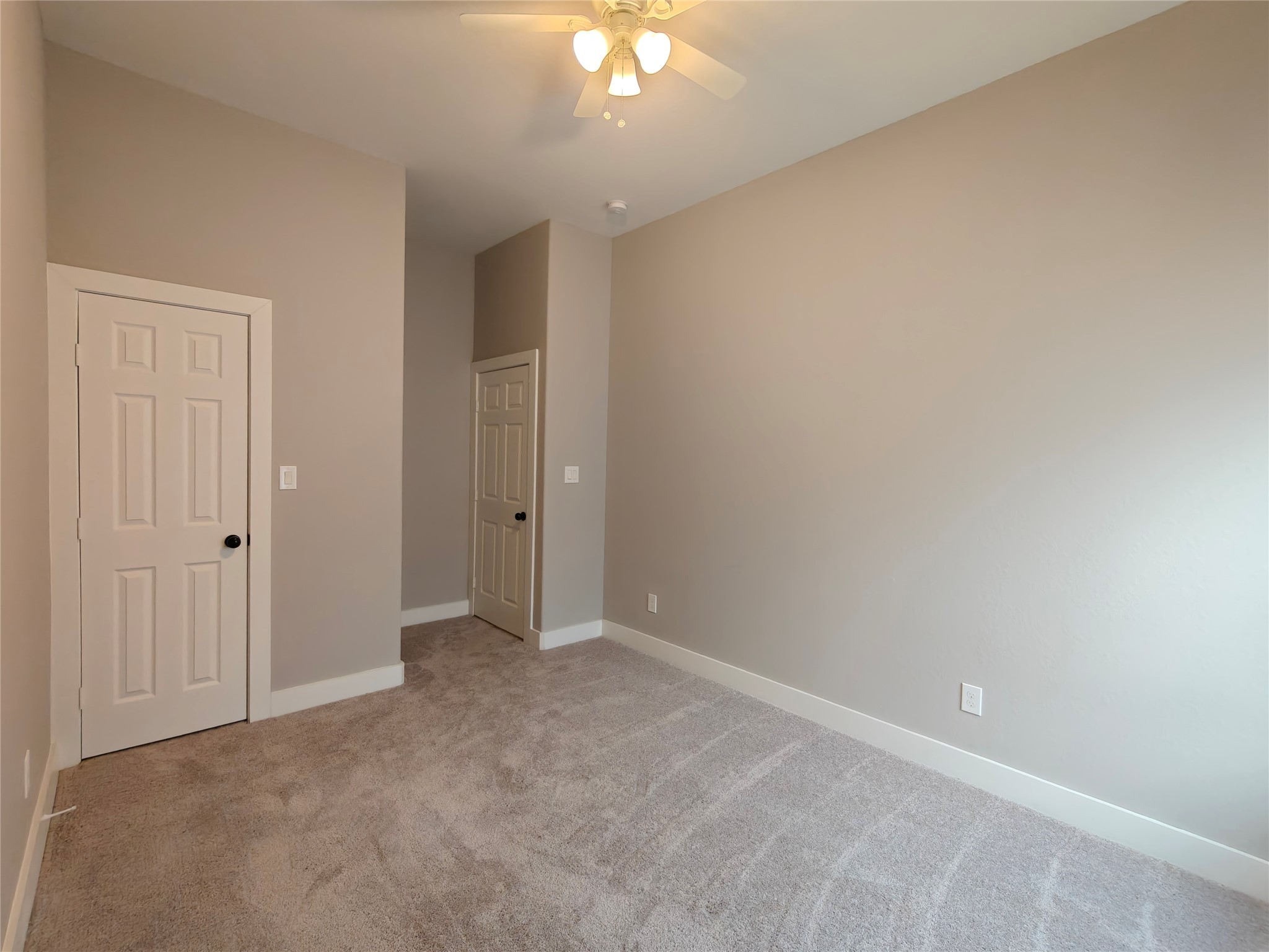4124 Vaughn Street, Unit B Houston, TX 77016 - Photo 16 of 19 a view of an empty room with a chandelier fan